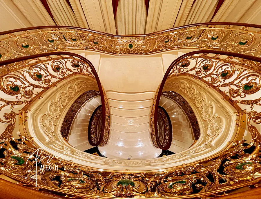 Overlook of curved classical stair railing and spatial layers