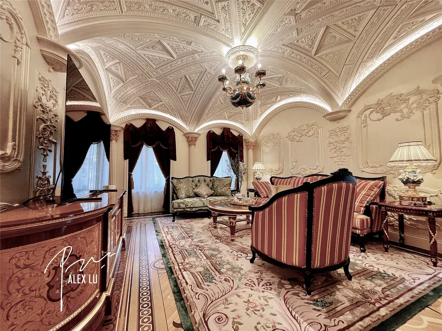 Classical family living room with light ceiling and soft furnishings